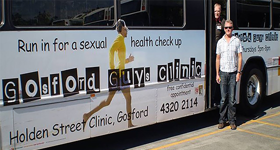 (L-R) Paul Maudlin & Michael Williamson, Bus Advertisment Gosford Guy’s Clinic / Photographer: Unknown