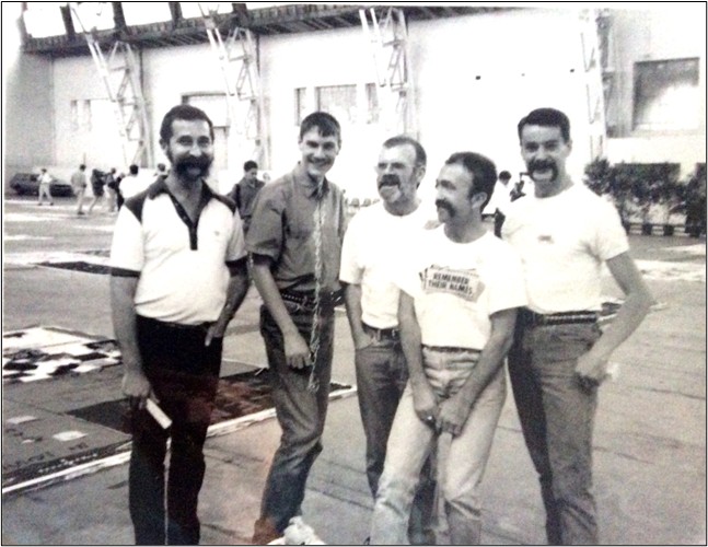 A 40 year journey into (and out of) fear (part 3) 7 Photo of Peter McCarthy, Peter Gilmore (deceased), Bevan (deceased), Steve Thompson and myself at an AIDS Quilt unfolding (we were unfolders) at the Royal Hall of Industries Pavilion (Sydney Showgrounds) circa 1992. The tee-shirts bear the Quilts Insignia, and “Remember Their Names”.